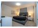Main bedroom with a king-size bed and stylish nightstands at 7049 Oakwood St, Davenport, FL 33837
