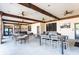 Indoor community room with tables and TVs at 7049 Oakwood St, Davenport, FL 33837