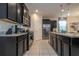 Modern kitchen with stainless steel appliances and granite countertops at 7049 Oakwood St, Davenport, FL 33837