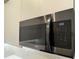 Modern stainless steel microwave installed in the kitchen at 17435 Hidden Forest Dr, Clermont, FL 34714