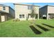 Landscaped backyard with a small tree and grassy area at 3690 Sagefield Dr, St Cloud, FL 34773