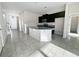Modern kitchen with dark cabinets and granite countertops at 3690 Sagefield Dr, St Cloud, FL 34773