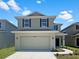 Two-story house with a two-car garage at 3690 Sagefield Dr, St Cloud, FL 34773