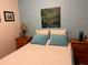 Cozy bedroom featuring a double bed, nightstands, and tranquil wall art at 7313 Cabor Ct, Orlando, FL 32818