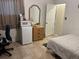 Bedroom with a mini-fridge, dresser and closet at 7313 Cabor Ct, Orlando, FL 32818