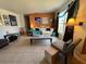 Bright living room with comfy seating and large artwork at 7313 Cabor Ct, Orlando, FL 32818