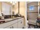 Double sink bathroom with granite countertop and neutral decor at 1160 Grand Traverse Pkwy, Reunion, FL 34747