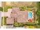 Bird's-eye view of a luxury home with a pool and spa at 1160 Grand Traverse Pkwy, Reunion, FL 34747