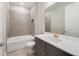 Clean bathroom with shower/tub combo, vanity, and grey cabinets at 2993 Water Clover Ct, Apopka, FL 32712