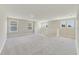 Bright loft area with carpet flooring and multiple windows at 2993 Water Clover Ct, Apopka, FL 32712
