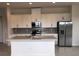 Modern kitchen with stainless steel appliances and an island at 2333 Datura Loop, St Cloud, FL 34772
