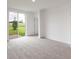 Spacious living room with sliding glass doors leading to patio at 1357 Current Pl, Haines City, FL 33844
