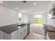 Modern kitchen with stainless steel appliances and granite countertops at 1357 Current Pl, Haines City, FL 33844