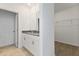 Clean bathroom with double vanity, granite countertop and walk-in closet at 1357 Current Pl, Haines City, FL 33844