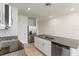 Bright kitchen boasts stainless steel appliances and granite countertops at 1357 Current Pl, Haines City, FL 33844