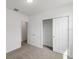 Spacious bedroom with a large closet and access to another room at 1357 Current Pl, Haines City, FL 33844
