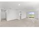 Spacious Gathering room with large windows and plush carpeting at 2466 Leeds St, Haines City, FL 33844