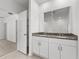Double vanity bathroom with granite countertops at 2466 Leeds St, Haines City, FL 33844