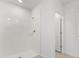 Bright bathroom with a shower and neutral tile at 2466 Leeds St, Haines City, FL 33844