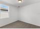 Simple bedroom with carpet flooring and a window at 2466 Leeds St, Haines City, FL 33844