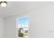 Bright bedroom with carpet flooring and a large window at 2466 Leeds St, Haines City, FL 33844