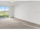 Bright bedroom with sliding glass doors leading to the backyard at 2466 Leeds St, Haines City, FL 33844