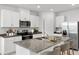 Modern kitchen with island and stainless steel appliances at 2466 Leeds St, Haines City, FL 33844