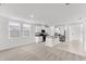 Open living room with kitchen and entryway views at 2466 Leeds St, Haines City, FL 33844