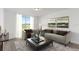 Relaxing living room with large windows and comfortable furniture at 2466 Leeds St, Haines City, FL 33844