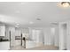 Open kitchen with stainless steel appliances and island at 2466 Leeds St, Haines City, FL 33844