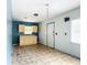 Small kitchen with light cabinets and tiled floors at 5136 Mcdonald Rd, Zellwood, FL 32798