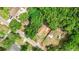 Aerial view showing a house and surrounding trees on a residential street at 5136 Mcdonald Rd, Zellwood, FL 32798