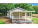 Charming single-story house with a front porch and small yard at 5136 Mcdonald Rd, Zellwood, FL 32798