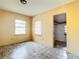 Simple bedroom with tiled floors and access to a closet at 5136 Mcdonald Rd, Zellwood, FL 32798