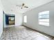 Living room with tiled floors, offering access to kitchen at 5136 Mcdonald Rd, Zellwood, FL 32798