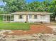 Front view of a small house with a covered porch at 5136 Mcdonald Rd, Zellwood, FL 32798