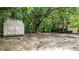 Large backyard with mature trees and a shed in the background at 5136 Mcdonald Rd, Zellwood, FL 32798