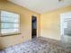 Small bedroom with tiled floors and access to another room at 5136 Mcdonald Rd, Zellwood, FL 32798