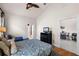 Bedroom with a queen bed, a twin bed, and access to a bathroom and dining area at 7576 Excitement Dr, Reunion, FL 34747