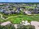 Aerial view of upscale community near golf course at 7576 Excitement Dr, Reunion, FL 34747