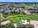 Aerial view of upscale community near golf course at 7576 Excitement Dr, Reunion, FL 34747