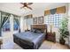 Main bedroom with a king-size bed and plenty of natural light at 7576 Excitement Dr, Reunion, FL 34747