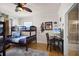 Bedroom with a bunk bed, a desk, and Star Wars decor at 7576 Excitement Dr, Reunion, FL 34747