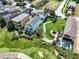 Aerial view showcasing a house with a pool and surrounding homes at 7576 Excitement Dr, Reunion, FL 34747