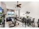 Living room with a sofa, a daybed, a small table, and a ceiling fan at 7576 Excitement Dr, Reunion, FL 34747