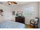 Bedroom with a bunk bed, a desk, and access to a bathroom at 7576 Excitement Dr, Reunion, FL 34747
