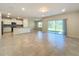 Open concept living area with kitchen and access to backyard at 1009 Rivers Crossing St, Clermont, FL 34714