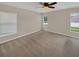 Bright bedroom with neutral walls, carpeting, and multiple windows at 205 Hibiscus St, Winter Haven, FL 33881