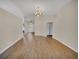 Bright and spacious living room with hardwood floors and a chandelier at 205 Hibiscus St, Winter Haven, FL 33881