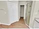 Bathroom featuring a shower, linen closet, and wood-look flooring at 205 Hibiscus St, Winter Haven, FL 33881